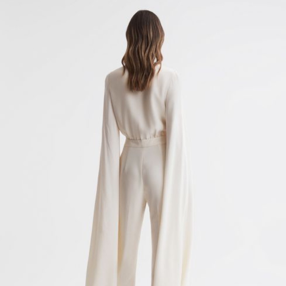 REISS OLIVIA CAPE SLEEVE V-NECK JUMPSUIT (IVORY)